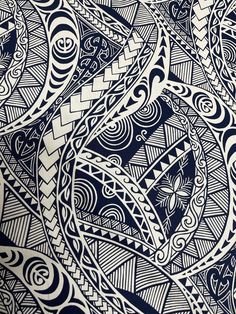 an intricate blue and white design on a piece of paper with some black lines in the middle