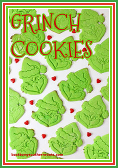 some green cookies are on a white surface with the words grin cookies written in red