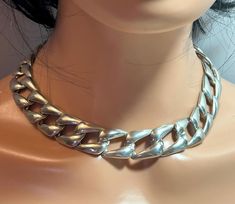 This is a beautiful, vintage, genuine, handmade Taxco sterling silver necklace. The necklace is about 18 inches and weighs an impressive 106.4 grams! The necklace features a curb link design and is 3/4" in width all around. It is so well-made and gorgeous! The necklace has a secure sterling silver slide box clasp and is stamped TC-89 925 Mexico, which is the hallmark and registration number of the Taxco artisan who handmade it in Taxco, Mexico. The necklace also has been tested and is genuine sterling silver. It is a work of art and a statement piece that will get you many compliments when wearing! See pictures for details. Check out my shop for more unique and one-of-a-kind vintage and antique jewelry in 970, 950 and 925 sterling silver and 18K, 14K and 10K white, rose and yellow gold, in Mexican Vintage, Slide Box, Mexican Silver Jewelry, Link Design, Sterling Necklaces, Mother Birthday Gifts, Box Clasp, Sterling Silver Cuff Bracelet, Vintage Mexican