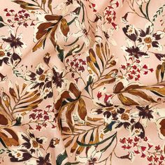 a pink floral print fabric with brown, white and red flowers on the bottom half of it