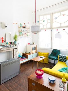 a living room filled with furniture and a flat screen tv