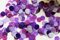 a pile of purple and white paper circles