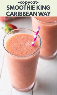 two glasses filled with smoothie next to strawberries