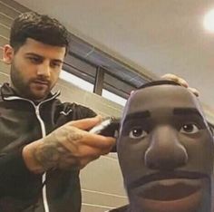 a man getting his hair cut by an animated character