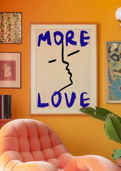 an orange chair sits in front of a poster with the word more love written on it