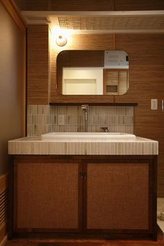 a bathroom with a sink and mirror in it