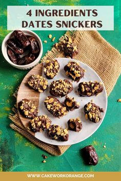 chocolate covered dates on a plate with nuts