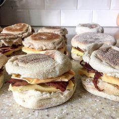 there are many sandwiches on the counter ready to be eaten