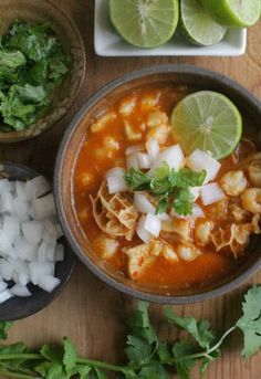 the mexican comfort food menu is ready to be eaten on the table with limes and cilantro