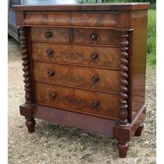 Large Victorian Mahogany Chest of Drawers, Scotch Chest   The chest is Heavy Quality and has well figured Flame Mahogany Veneers with large barley twist pillars on either side and it has an attractively shaped top with a secret drawer.  The Chest has a secret drawer, over 2 short and 3 long graduated drawers, the chest stands on turned feet, it has the original turned wooden handles The overall condition of the chest is good, with only minor signs of its previous life, it has a good finish and i Victorian Dressers, Secret Drawer, Barley Twist, Previous Life, Wooden Handles, Barley, Chest Of Drawers, Scotch, Dresser