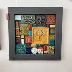 there are many different items on the wall in this picture, and one is made out of clay