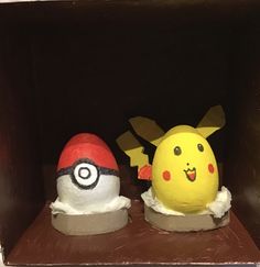 two cakes made to look like pokemon pikachu and pokeball