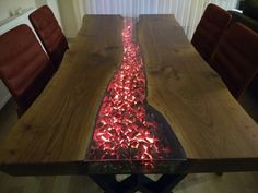 a wooden table with red lights on it