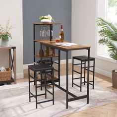 Elevate your dining experience with our stylish bar table set! The 3-piece dining table set includes 1 rectangular table and 2 matching bar stools. The spacious tabletop has a special cup holder, which can be used to place cleaned cups, which is also very convenient for daily use. There is a three-layer storage rack under the table can amplify your storage, the open shelf and wine rack for tableware, wine, and snacks. Moreover, the stool can be placed under the table when not in use, reducing th Wine And Snacks, Bar Table And Chairs, Pub Dining Set, Bar Table Set, Bar Table Sets, Bar Height Table, Counter Height Table, Extension Table, Counter Height Dining Sets