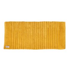 a yellow bath mat with pleated edges on the bottom and one line down the middle