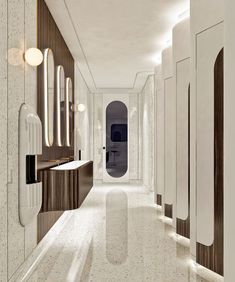 a long hallway with mirrors and lights on the walls