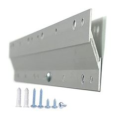 two metal brackets and screws are attached to the side of a white wall mounted shelf