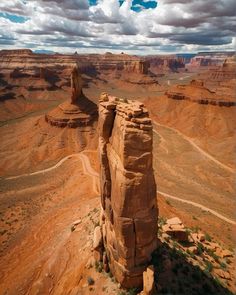 a large rock formation in the middle of a desert