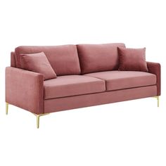 a pink couch with gold legs and pillows on it's back end, against a white background