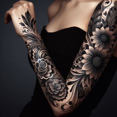 a woman's arm with flowers and leaves tattooed on her arms, in front of a black background