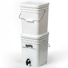 two white buckets stacked on top of each other