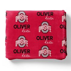 the university of ohio flee blanket is red with black and white letters that read,'oh