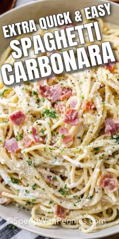 spaghetti carbonara with bacon and parsley in a white bowl on a checkered table cloth