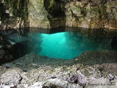 the water is clear and blue in this cave