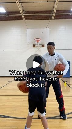 two young men playing basketball on an indoor court with the words when they throw that hand, you have to block it