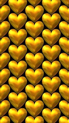 many gold hearts are arranged in the shape of a heart