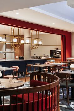 an empty restaurant with tables and chairs