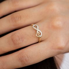 14k Solid Gold Infinity Ring, Heart Ring, Minimalist Real Ring, Heart Ring for Women, Love, Gift For Mom, Gift For Christmas INFINITY RING What is an infinity love ring? Also known as the promise ring, this ring is typically designed to symbolize unending love, signifies eternal devotion and everlasting love. The infinity heart ring has long been used as a token to express the promise of a lifetime commitment in a romantic relationship. Couples wishing to celebrate their unbreakable bond or to mark their commitment to each other may opt for infinity rings. It is the perfect gift for your special person as a symbol of love that goes on and on forever. ▷ Material  : 14k Solid Gold ✔ Each order will be sent to you with a box to avoid any damage during shipping. ✔ Visit our store, browse other Infinity Heart Ring For Valentine's Day Anniversary, Valentine's Day Infinity Heart Ring For Anniversary, Dainty Infinity Stackable Promise Rings, Valentine's Day Infinity Heart Ring, Infinity Heart Ring For Valentine's Day Promise, Infinity Heart Ring For Valentine's Day, Heart Infinity Ring, Fiance Ring, Gold Infinity Ring