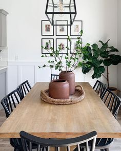 a wooden table topped with a potted plant