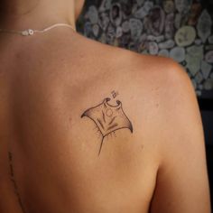 a woman with a tattoo on her back