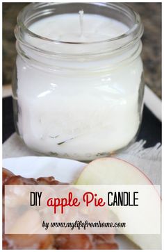 an apple pie candle sitting on top of a white plate