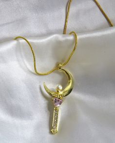 This sailor moon inspired necklace has a gold charm with pink accents and sits on a non adjustable chain.  perfect celestial/ divine feminine vibes!  free shipping on orders over $35 in the us please review all info carefully i do not accept returns or exchanges! Sailor Moon Inspired, Feminine Vibes, Celestial Necklace, Inspired Necklace, Moon Jewelry, Pink Accents, Divine Feminine, Gold Charm, Sailor Moon