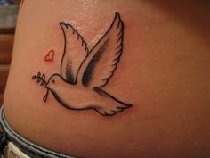 a bird with a heart tattoo on the side of her stomach is seen in this photo