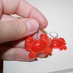 "Red Crab Earrings They measure 1.25\" long Hooks are sterling plated, extra secure and work with gauges" Red Novelty Drop Earrings, Red Resin Novelty Earrings, Novelty Red Resin Jewelry, Red Resin Novelty Jewelry, Novelty Red Pierced Earrings, Crab Earrings, Red Crab, Ocean Earrings, Mermaid Earrings