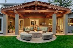 an outdoor living area with seating and fire pit