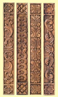 three carved wooden panels with designs on them