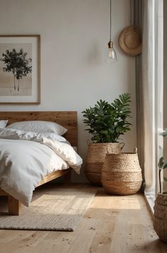 a bed sitting in a bedroom next to a window and potted plant on the floor