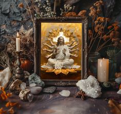 an image of the immaculate mary surrounded by rocks and candles in front of a painting