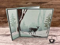 a card with a deer in the woods