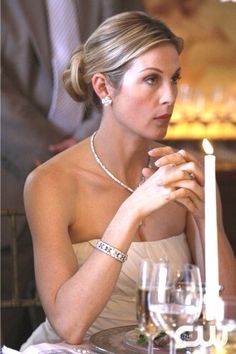 three pictures of women at a table with wine glasses and candles in front of them