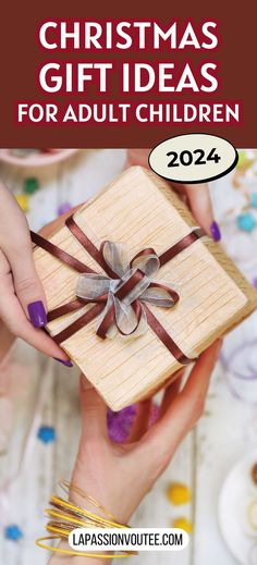 two hands holding a small wooden gift box with ribbon and bow on it, in front of