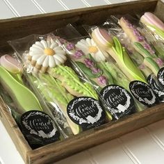 a wooden box filled with different types of flowers