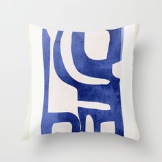 a blue and white pillow with an abstract design