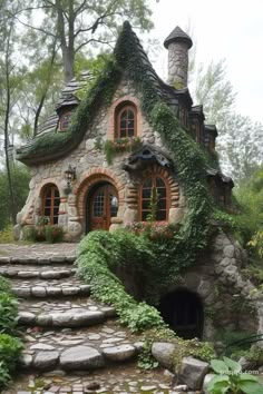 a stone house with ivy growing on it's roof and steps leading up to the entrance