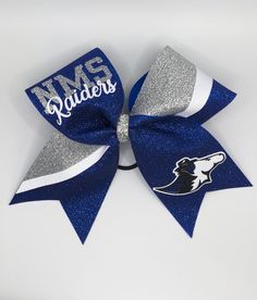 "1 Large 7\"x7\" glitter cheer bow made with 3\" grosgrain ribbon All bows can be customized to your team colors and logo!" Cheer Bows Ideas, Cheer Bow, Competition Cheer Bows, Cheer Captain Bows, Cheer Bows Rhinestones, Blue And White Cheer Bows, Cheer Hair Bows, Cheerleading Bows, Glitter Cheer Bow