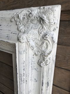 an old white door with carvings on it